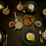 Homemade Korean bibimbap, kimchi soup and patron seafood pancake